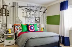 a bedroom decorated in green, white and red with a captain's shield on the wall