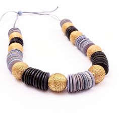 a necklace with several different colored beads