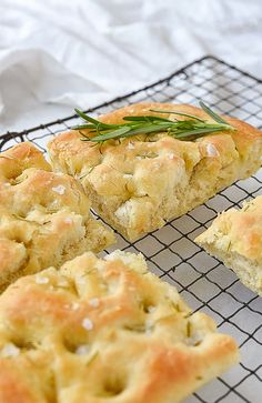 some food that is sitting on a cooling rack and next to it are slices of bread