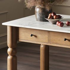 a marble top table with some fruit on it