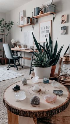 a potted plant sitting on top of a wooden table in front of a desk