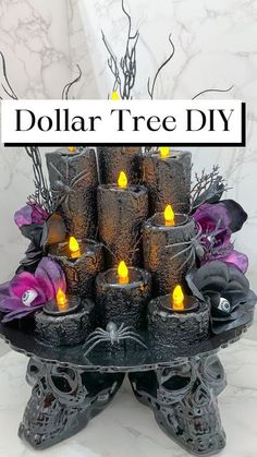 there is a display with candles and skulls on the table in front of it that says dollar tree diy