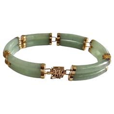 Fortune A-Jadeite Bracelet Double Bars with 14K Solid Yellow Gold links and clasp Our 'Double Fu Fuku Fortune A-Jade Bracelet' embodies radiance and stature, with hand carved jade lengths intertwined with 14K Gold; a unisex statement. The two layers of cylindrical Jade tubes stands for courage and strength. This is a spring green variation of our 'Double Fu Fuku Fortune Jade Bracelet'. Our creative team handpicked the A-jade to symbolize the current Season. The two layers of cylindrical Jade tub Carved Jade, Jade Bracelet, Jade Carving, Creative Team, Spring Green, Solid Yellow, Bangle Bracelets, Jade, Jewelry Bracelets