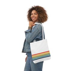 Our lightweight and durable LGBT Pride Tote Bag, inspired by vintage aesthetics features a distressed rainbow design. This versatile tote is the perfect accessory to showcase your pride and support for the LGBTQ+ community. Crafted from high-quality polyester canvas, this tote bag is not only lightweight but also built to last. Its durable construction ensures it can withstand everyday use and carry your belongings with ease. Whether you're running quick errands, going on shopping trips, or embarking on longer travels, this tote bag is designed to meet your needs. The interior of the bag features a sleek black lining, adding a touch of sophistication.  Available in three convenient sizes, you can choose the one that suits your specific requirements. Whether you need a compact bag for quick Retro Everyday Canvas Shoulder Bag, White Retro Tote Shoulder Bag, Rainbow Shoulder Bag For Everyday Use, Retro White Canvas Bag For Daily Use, Retro White Bags For Everyday Use, Retro White Bag For Everyday Use, Rainbow Rectangular Shoulder Bag For Everyday, White Retro Shoulder Bag For Everyday Use, White Retro Canvas Bag For Everyday Use