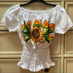 Embroidered Mexican Off-The-Shoulder Blouse Size M White Beautiful Embroidered Sunflowers Hand Wash Recommend New Without Tags Summer Embroidered Off-shoulder Blouse, Embroidered Off-shoulder Blouse For Summer, White Embroidered Off-shoulder Top, Spring Embroidered Off-shoulder Top, Summer Off-shoulder Top With Floral Embroidery, Summer Off-shoulder Floral Embroidered Top, Summer Off-shoulder Embroidered Top, Cotton Off-shoulder Tops With Floral Embroidery, Fitted Embroidered Peasant Top