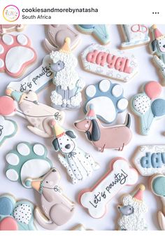 some cookies are laying on top of each other and decorated with different types of animals