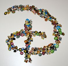 a peace sign made out of many different types of buttons