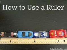 toy cars lined up next to a ruler that says how to use a ruler