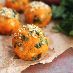 several balls of food with herbs on them