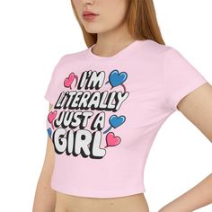 This Women's Baby Tee features the fun and quirky text 'I'm Literally Just A Girl'. Perfect for casual days out or lounging at home, this tee gives off a laid-back and carefree vibe. It is relevant to women who enjoy comfortable fashion with a touch of humor. Great for everyday wear, casual hangouts, or as a gift for birthdays or other special occasions. Product features - 100% organic cotton for sustainability - Slim fit for a flattering silhouette - Direct-to-Film (DTF) print for a unique desi Cute Graphic Tees, Dtf Print, Gift For Daughter, Baby T Shirts, Girl Clothing, Just A Girl, Funny T Shirt, Baby Tee