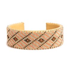 an orange and brown beaded bracelet on a white background