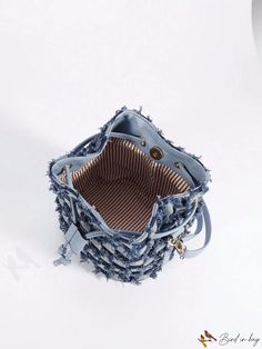 BirdinBag - Stylish Denim Mini Bucket Bag with Random Checkered Pattern and Raw Trim Trendy Denim Bucket Bag, Trendy Denim Bucket Shoulder Bag, Daily Use Denim Bucket Shoulder Bag, Denim Bucket Shoulder Bag For Daily Use, Denim Bucket Bag For Travel, Casual Blue Bucket Bag, Denim Blue Pouch Bag, Denim Blue Denim Pouch Bag, Everyday Distressed Denim Blue Bag