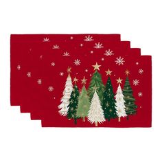 three napkins with christmas trees and snowflakes on them