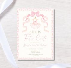 a pink and white birthday party card with a ballerina on the front, ribbon around it