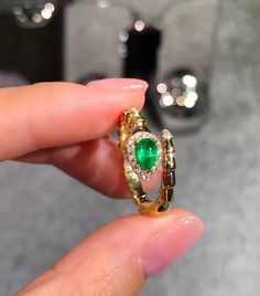 Model Number: ERD3PGX020 18K yellow gold plain snake ring Available: Yellow Gold and White Gold Metal Stamp: 18k AU750 Metals Type: 18K Gold Weight/g: 4.09 Stone: Material Emerald/ 1pc and Weight/ct 0.46 Side Stone: Diamond/1 8pcs and Weight/ct 0.12 Metal Color: Yellow Gold Setting Type: Prong Setting Gender: Unisex Fine Luxury 14k Gold Snake-shaped Ring, Yellow Gold Diamond Ring In Snake Shape, Elegant Yellow Gold Snake Ring, Gold Diamond Snake Ring Fine Jewelry, Yellow Gold Snake-shaped 14k Gold Rings, Gold Fine Jewelry Snake-shaped Ring, Gold Snake-shaped Diamond Ring, Luxury Yellow Gold Snake Shaped Ring, Elegant Yellow Gold Snake Diamond Ring