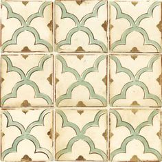 an old tile pattern with green and white designs