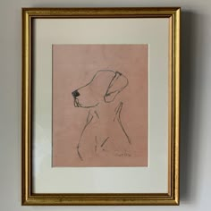 a drawing of a dog is hanging on the wall