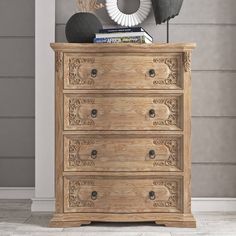 a wooden chest of drawers in a room