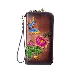 a brown wallet with flowers and butterflies on it