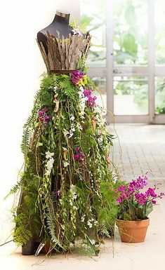 a dress made out of plants and flowers