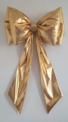 a gold bow on a white background