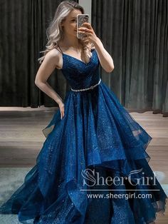 Cheap simple navy v neck prom dresses with ruffled skirt, decorated with rhinestone sash. It can be made in other colors, please contact us 1.Silhouette: A Line 2.Fabric: Sparkly Tulle 3.Embellishment: Rhinestone Sash 4.Neckline: V Neck 5.Sleeve: Sleeveless 6.Waistline: Natural 7.Hem-length: Floor length 8.Back Details: Zipper 9.Fully Lined:Yes 10.Buit-In Bra:Yes 11.Boning:Yes 12.Picture Color: Navy/Burgundy/Black(For other colors, please check our Color Chart) Shiny Ball Gown, Quince Dresses Pink, White Mini Dress Outfit, Red Dresses Classy, V Neck Prom Dresses, Blue Dress Formal, Blue Tulle, Ball Gowns Evening, Long Prom Dresses