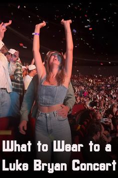 a group of people at a concert with confetti in the air above them