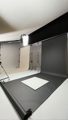 an empty photo studio with lighting equipment