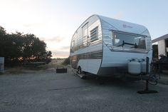 an rv is parked on the side of the road