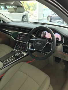 the interior of an audi car is clean and ready for customers to ride in it