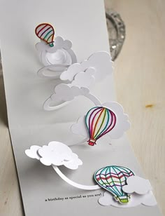 a card with some hot air balloons on it