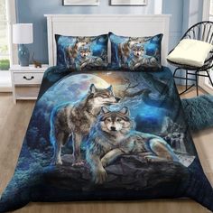 two wolfs are standing in front of the night sky on this bedding set