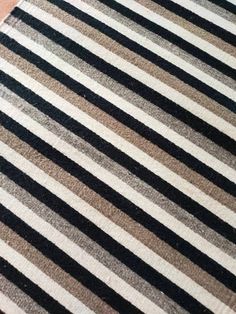 a striped rug is laying on the floor