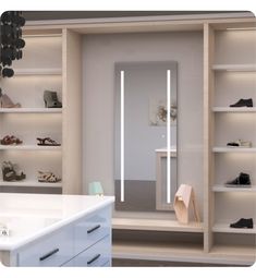 an empty walk - in closet with shoes on shelves and lights above the shoe rack