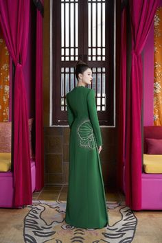 The epitome of luxury and elegance. This Ao Dai is the perfect blend of comfort and sophistication. The smooth velvet and soft satin will make you feel like royalty, while the flattering sheath silhouette highlights your figure. Elevate your style with Vivacy. Length: 150cm (Ao Dai), 110cm (Pants) Elegant Long Sleeve Gown For Ceremonial Occasions, Elegant Long Sleeve Ceremonial Ao Dai, Elegant Long Sleeve Ao Dai For Ceremonial Occasions, Elegant Long Sleeve Ao Dai For Ceremonies, Elegant Fitted Ceremonial Gown, Elegant Fitted Gown For Ceremonial Occasions, Elegant Green Ceremonial Dress, Elegant Green Dress For Ceremonial Occasions, Mean Blvd