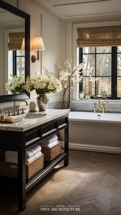 a bathroom with a tub, sink and mirror in it's centerpieces