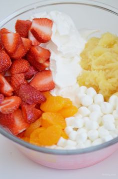 a bowl filled with fruit and marshmallows