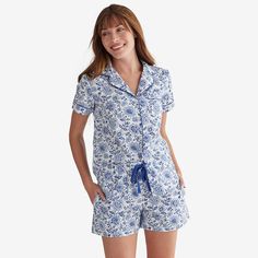 {"Our printed Cotton Poplin Women's Pajama Shorts Set is patterned in your choice of three fresh designs for a new season a scrolling Paisley vine, whimsical Flamingo, or beautiful Blue Jacobean floralRelaxed fit. 100% cotton poplin. Cool and crisp, the fabric is perfect for warmer weather or hot sleepers. Short-sleeve button-down top has a notch collar, contrast piping, twill tape accents, and a shirt-tail hem. Shorts have an elasticized waistband with twill tape ties and side pockets. Imported Poplin Shorts, Flamingo Color, Womens Pajama Shorts, The Company Store, Short Pj Set, Womens Pyjama Sets, Contrast Piping, Notch Collar, Sleepwear & Loungewear