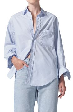 Crisp cotton poplin breaks away from its tailored reputation with this oversized button-up shirt featuring billowy sleeves and a high-low hem. 23" to 31" length (size Medium) Front button closure Spread collar Long sleeves with button cuffs Chest patch pocket 100% cotton Machine wash, tumble dry Imported Poplin Shirt With Button Closure For Daywear, Spring Daywear Shirt With Shirttail Hem, Daywear Poplin Tops With Button Closure, Daywear Tops With Button Closure, Poplin Tops With Button Closure For Daywear, Spring Shirttail Hem Shirt For Daywear, Oversized Spring Shirt With Placket, Oversized Poplin Tops For Spring, Oversized Spring Shirt