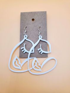 These abstract face earrings are so fun and unique! They are bold and attention grabbing. We get so many compliments when we wear them. They are large but very lightweight. They are 3D printed and made from an eco friendly corn based plastic. White Drop Wrap Earrings As Gift, Artsy White Pierced Earrings, Artsy White Earrings, White Artsy Earrings With Ear Wire, Artsy White Earrings With Ear Wire, 3d Earrings, Cartoon Paper, Artsy Earrings, 3d Printed Earrings