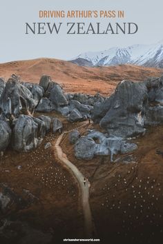 the cover of driving arthur's pass in new zealand, with an image of rocks and