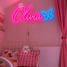 a pink neon sign that says ollivia's on the wall above a bed