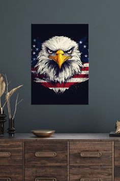 an eagle with the american flag painted on it's face in front of a gray wall