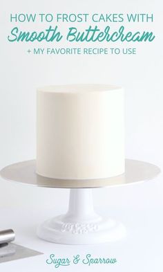 a white frosted cake sitting on top of a plate