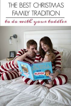 a man and woman are reading a book together on the bed with text overlay that says, the best christmas family tradition to do's with your toddler