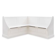 a white corner bench with storage drawers