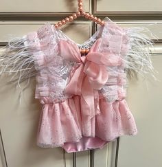 This set is custom made to order. Please check current make times🤍  This romper is the SWEETEST photo prop!! This little romper is intended for a photography prop. It is very delicate and not intended for everyday wear.  Spot clean and line dry only please.  Available in sitters 6-12 months and newborn. Cute Pink Bubble Romper For Party, Cute Pink Bubble Romper For Cake Smash, Cute Pink Bubble Romper For First Birthday, Sleeveless Ruffled Bubble Romper For First Birthday, Pink Sleeveless Bubble Romper For First Birthday, Feather Romper, Pink Ruffles Bubble Romper For Cake Smash, Pink Feathers, 12 Months