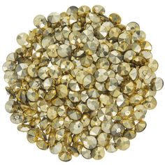 a pile of gold colored beads on a white background