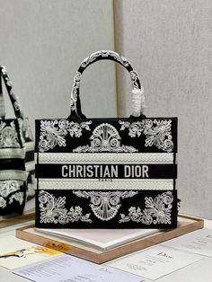 Christian dior handbags: a symphony of style and luxury - 497This is a premium quality clone , similar like the original ones, even no one can judge either it&apos;s a clone or originalSize: (36x28 cm) It comes with Dust box, Care manual, Tag and Paper bag. Bag Print Design, Christian Dior Handbags, Tas Fashion, Dior Book Tote, Dior Handbags, Dior Bag, Christian Dior, Luxury Bags, Contact Us