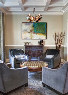 a living room filled with furniture and a chandelier